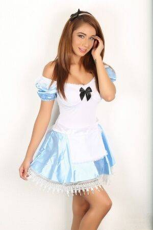 Naughty girl flashes no panty upskirt wearing Alice In Wonderland attire on nudesceleb.com