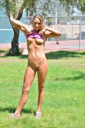 Fit blonde jogger in short shorts revealing wide open twat in public park on nudesceleb.com