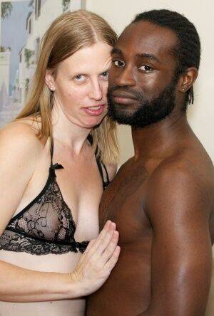 White amateur deepthroats her black lover's cock in lingerie ensemble on nudesceleb.com