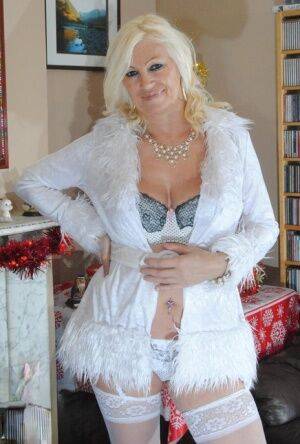 Older amateur Platinum Blonde shows her floppy tits in white panties & hosiery on nudesceleb.com