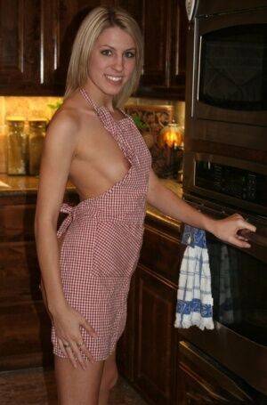 Young amateur removes a kitchen apron to get completely naked on nudesceleb.com