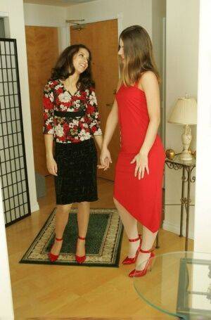 Lesbian women kiss while wearing matching ankle strap red heels on nudesceleb.com