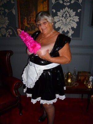 Fat old maid Grandma Libby doffs her uniform to pose nude in stockings on nudesceleb.com