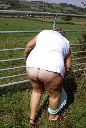 Old British woman Grandma Libby exposes herself next to a field of cattle - Britain on nudesceleb.com