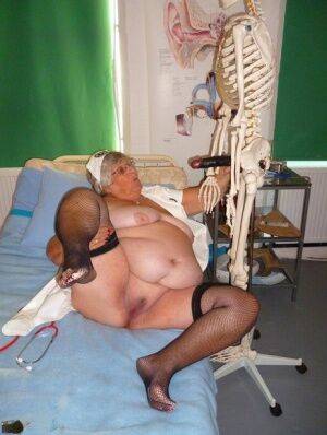 Fat old nurse Grandma Libby attaches a dildo to a skeleton for sexual relief on nudesceleb.com