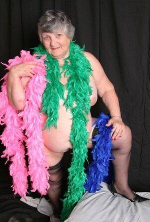Fat UK amateur Grandma Libby shows her big tits while draped in feather boas - Britain on nudesceleb.com