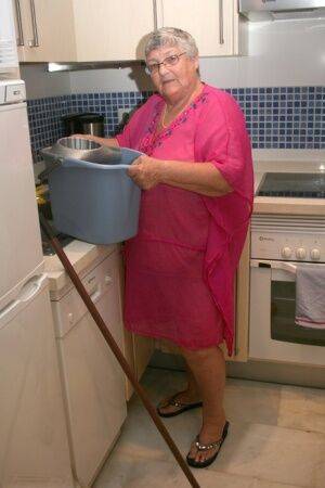 Fat UK nan Grandma Libby gets completely naked while cleaning her kitchen - Britain on nudesceleb.com