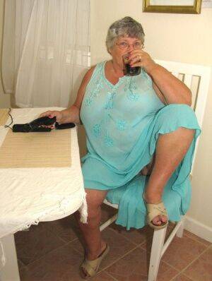 Obese amateur Grandma Libby bares her tan lined body after a phone sex on nudesceleb.com