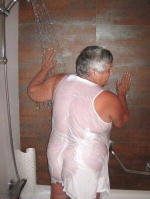 Obese amateur Grandma Libby blow drys her hair after taking a shower on nudesceleb.com