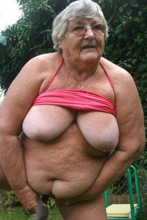 Fat nan Grandma Libby bares her huge ass before licking a nipple in her yard on nudesceleb.com
