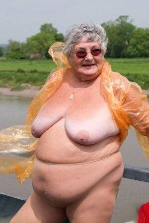 Obese British amateur Grandma Libby casts off a see-through raincoat - Britain on nudesceleb.com