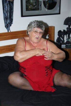 Overweight nan Grandma Libby finger fucks on a bed in lingerie and nylons on nudesceleb.com