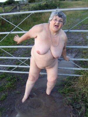 Fat nan Grandma Libby steps into a puddle before covering herself in mud on nudesceleb.com