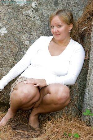 Chubby blond amateur Claire J flashing white panty upskirt outdoors on nudesceleb.com