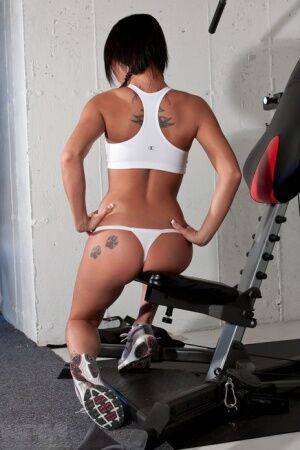 Hot sexy Nikki Sims whale tailing topless at the gym in white thong panties on nudesceleb.com