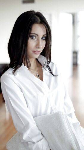Brunette babe Jade Jantzen posing fully clothed in white blouse and skirt on nudesceleb.com