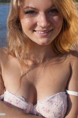 White teen Patritcy A slips off lace lingerie to pose naked at the beach on nudesceleb.com