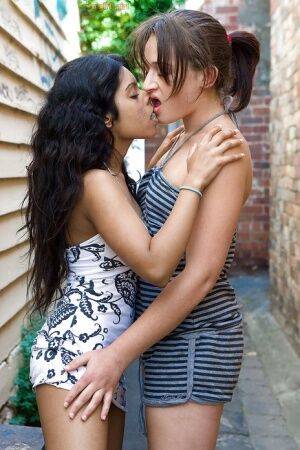 Indian lesbian Kiki tongue kissing white girlfriend Lou-Ellyn outdoors - India on nudesceleb.com