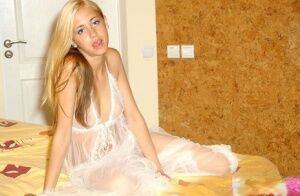 Hot young blonde teen in sheer white lingerie posing with tiny tits beared on nudesceleb.com