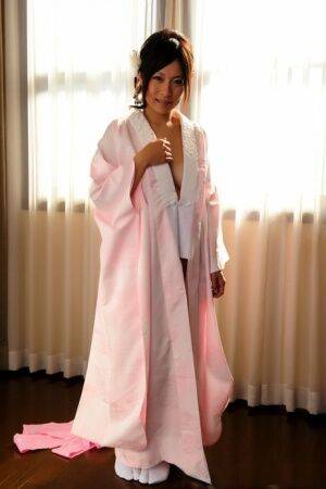 Japanese solo girl slips off her robe to reveal her nice boobs in white socks - Japan on nudesceleb.com