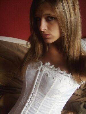 Teen in white corset and tight panties showing off her perfect tight body on nudesceleb.com