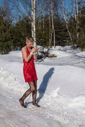 White female is toed up and forced to stand and kneel in snow on nudesceleb.com