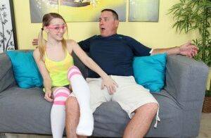 Geeky blonde teen wanking a massive white bone on the sofa on nudesceleb.com