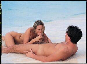 Hot blond chicks gets banged hard on the white sand of a tropical island beach on nudesceleb.com