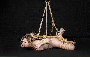 Naked white girl Kama Medea is suspended by ropes while anally hooked on nudesceleb.com