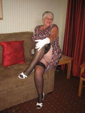 Silver haired nan Girdle Goddess bares her big tits and twat in white gloves on nudesceleb.com