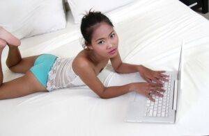 Petite Asian girl launches her nude modeling career atop white bed sheets on nudesceleb.com