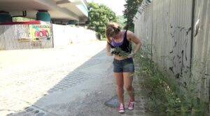White girl pulls down her panties before squatting for a piss on country road on nudesceleb.com