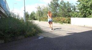 White girl Lucka pulls down jeans shorts for a pee on the side of a road on nudesceleb.com