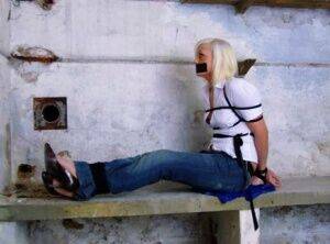 British woman is tied up and gagged in blue jeans and a white shirt - Britain on nudesceleb.com