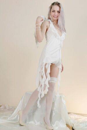 Egida looks so hot in her white angel costume and even more when she undresses on nudesceleb.com