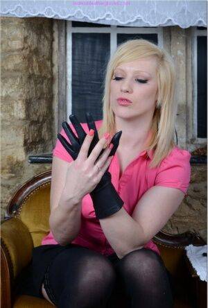 Natural blonde Axajay slides panties aside after donning leather gloves on nudesceleb.com