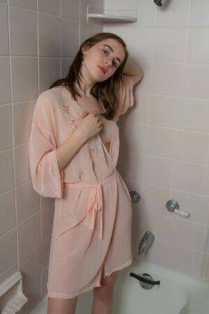 Cute young teen Eva Green petting her wet bald pussy in the shower on nudesceleb.com