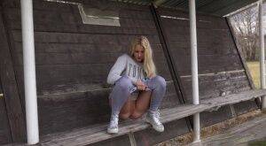 Blonde Katy Sky pisses next to a football field on nudesceleb.com