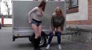 Katy Sky and Victoria Daniels duck behind a trailer for a much needed piss on nudesceleb.com