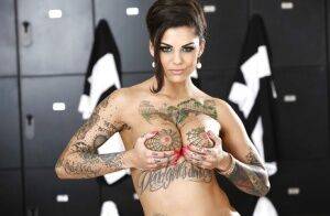 Tattooed brunette Bonnie Rotten is teasing her big tits on camera on nudesceleb.com