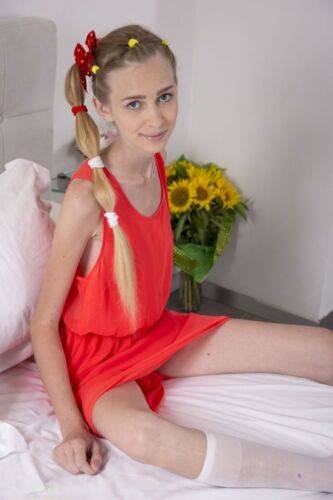 Skinny young Ivanka poses her thin flat chested body naked in knees socks on nudesceleb.com