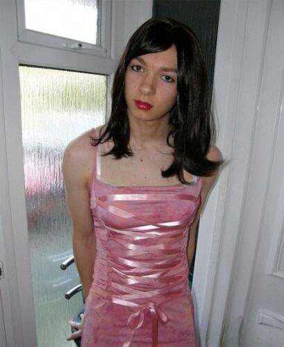 Petite TGirl showing off that slender body of hers in a pink dress on nudesceleb.com
