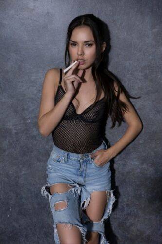 Petite girl Dominique Gabrielle works free of ripped jeans to pose nude on nudesceleb.com