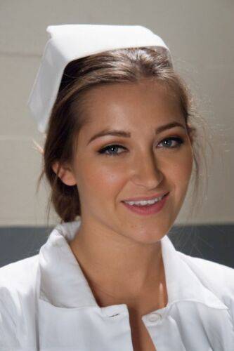 Gorgeous nurse with a nice butt Dani Daniels strips and poses in high heels on nudesceleb.com