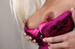 Lingerie model Maria is demonstrating her big tits in close up on nudesceleb.com