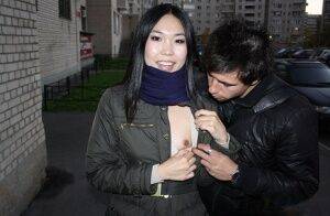 Asian girl Yiki gets involved in MMF sex in an alley with big cocks on nudesceleb.com