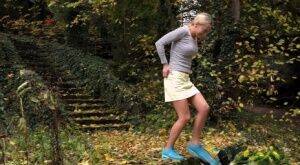 Cute blonde Victoria Pure hikes her skirt to take a pee along country lane on nudesceleb.com
