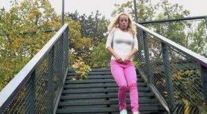 Blonde Victoria Pure pulling down her tight pants to pee on the bleachers on nudesceleb.com