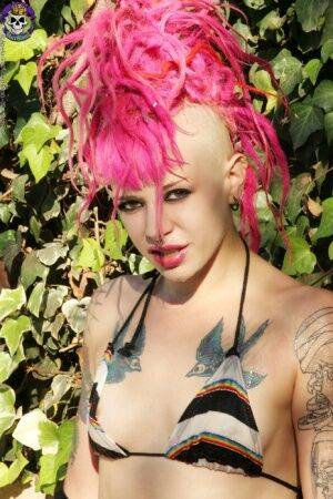 Pink haired tattooed punk girl by the pool on nudesceleb.com