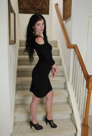 Clothed milf beauty Veronica Stewart is taking off her black dress on nudesceleb.com